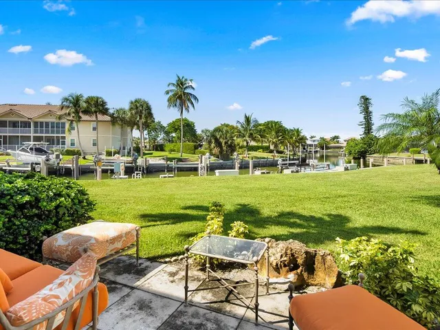 a view of yard with swimming pool outdoor seating and green space