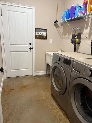 a room with pool table and windows