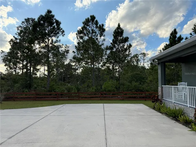 a view of a house with roof deck front of house