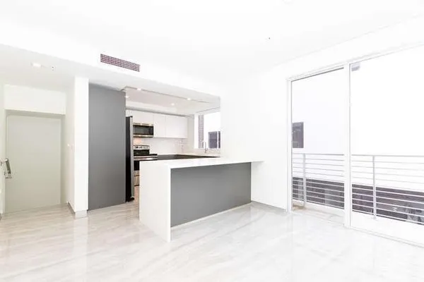a kitchen with a refrigerator stove and microwave