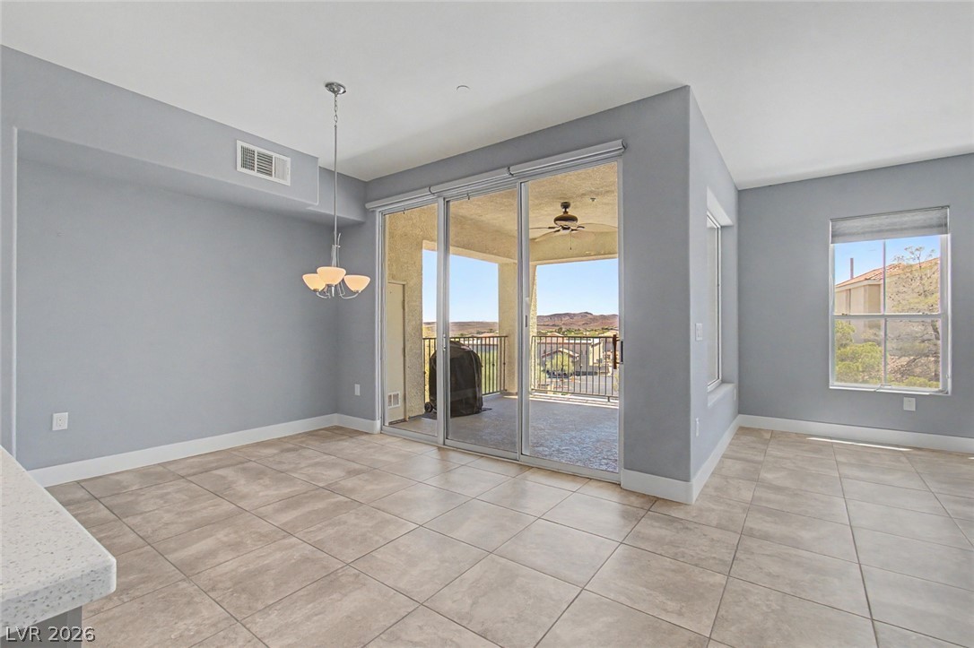 2555 Hampton Road, Unit 6308 Henderson, NV 89052 - Photo 18 of 30 Natural light floods this dining area, conveniently between the kitchen counter and deck with views through the glass door to the east.
