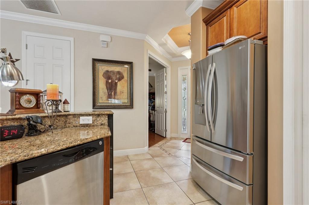 19612 Tesoro Way Estero, FL 33967 - Photo 16 of 50 a bathroom with a granite countertop sink and a mirror