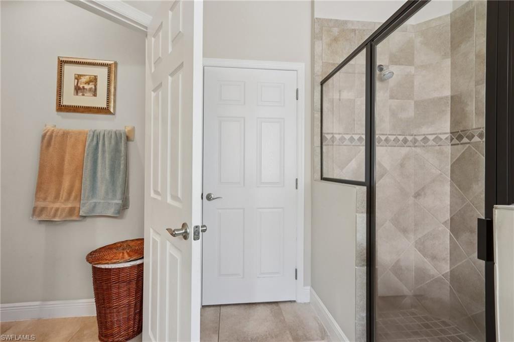 19612 Tesoro Way Estero, FL 33967 - Photo 22 of 50 a bathroom with a shower and a sink