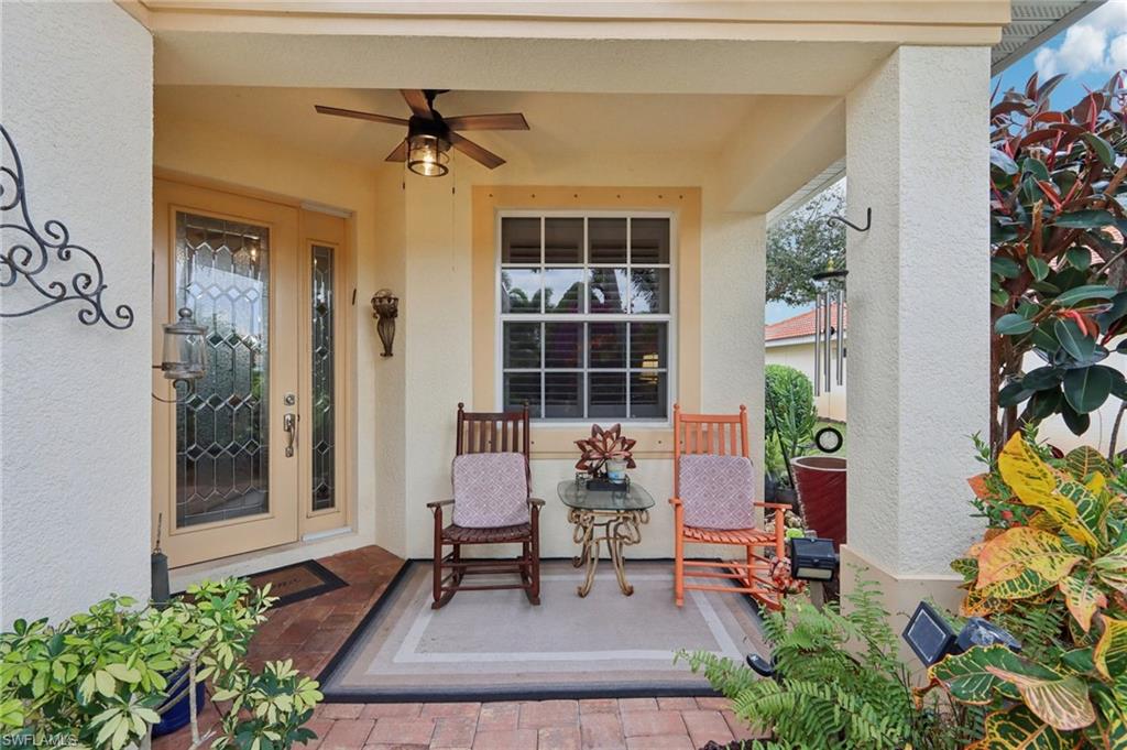 19612 Tesoro Way Estero, FL 33967 - Photo 3 of 50 a view of a lobby with chair and flower pot
