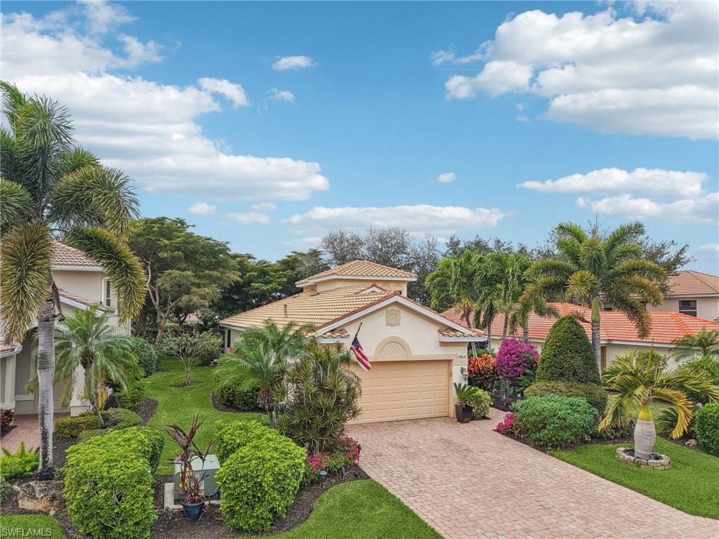 19612 Tesoro Way Estero, FL 33967 - Photo 35 of 50 a view of house with garden