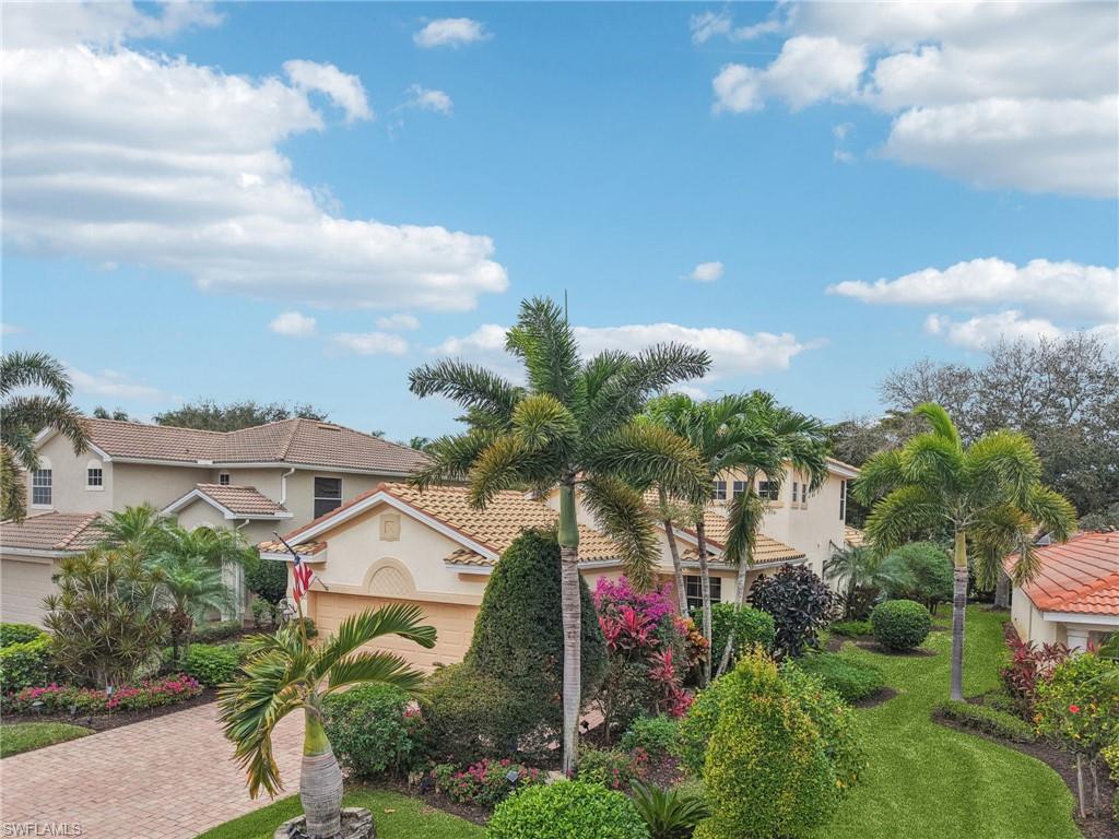 19612 Tesoro Way Estero, FL 33967 - Photo 36 of 50 a view of a house with a street