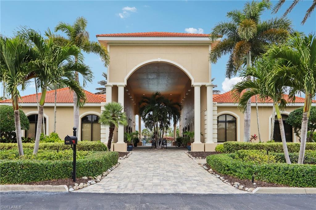 19612 Tesoro Way Estero, FL 33967 - Photo 47 of 50 a front view of a house with garden
