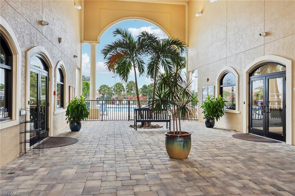 19612 Tesoro Way Estero, FL 33967 - Photo 48 of 50 a view of a building with potted plants