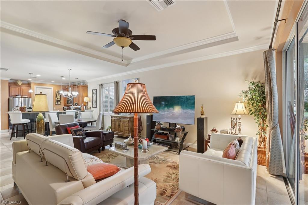 19612 Tesoro Way Estero, FL 33967 - Photo 8 of 50 a living room with furniture fireplace and a window