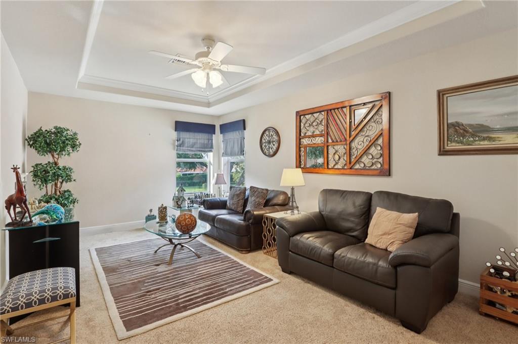 19612 Tesoro Way Estero, FL 33967 - Photo 10 of 50 a living room with furniture and a chandelier