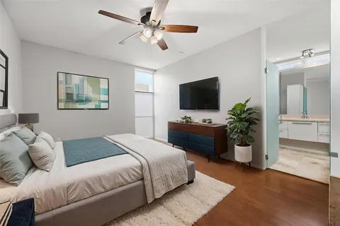 a dining room with furniture and wooden floor