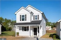 a front view of a house with garage