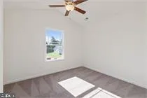 a view of an empty room and a window