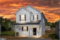 a front view of a house with garage