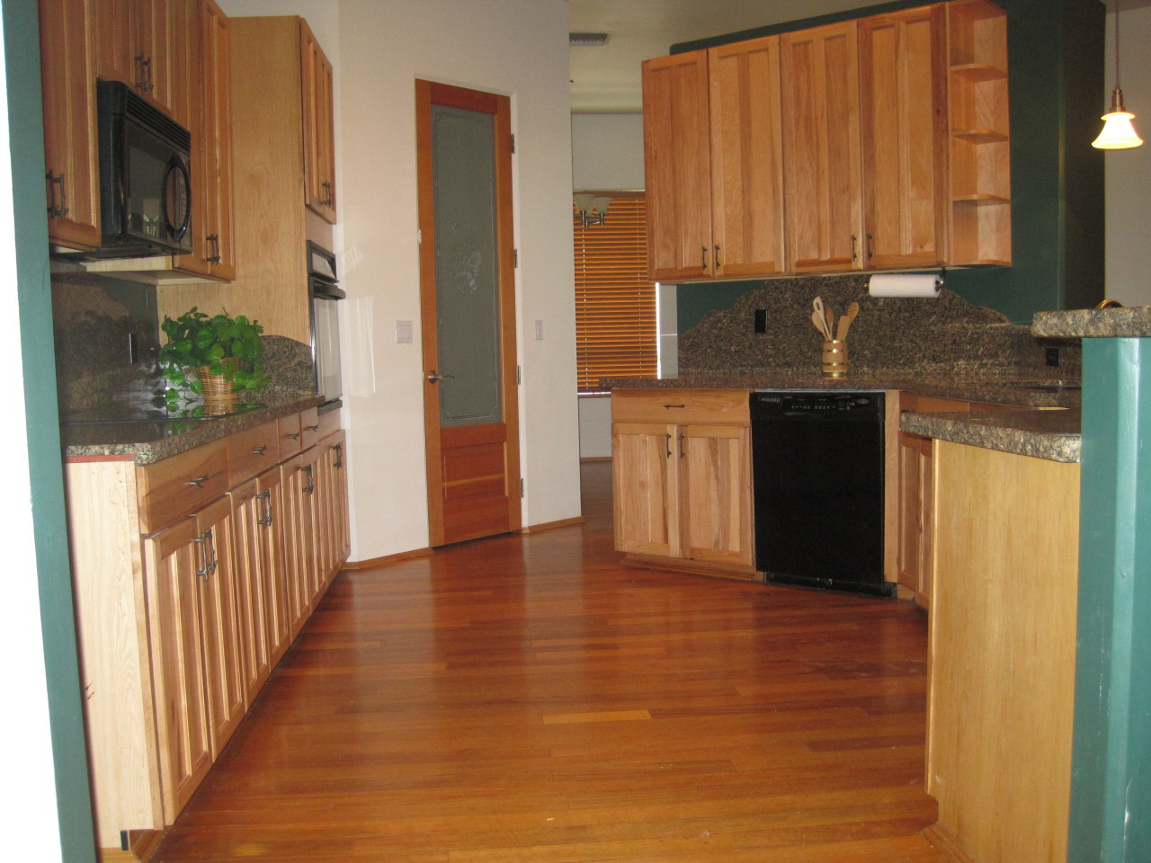 1005 West Dolores Road Phoenix, AZ 85086 - Photo 4 of 28 Kitchen with Hickory Cabinets & Granite
