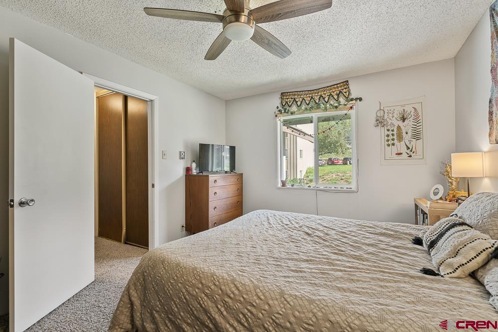 34237 Highway 550, Unit 18 Durango, CO 81301 - Photo 17 of 21 a bedroom with a bed and a window