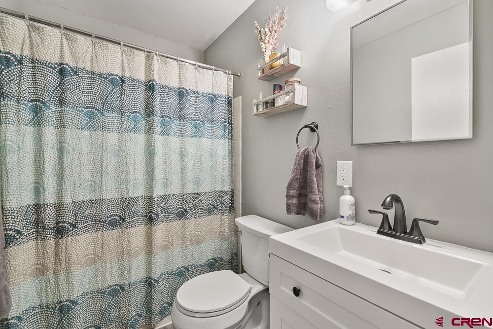 34237 Highway 550, Unit 18 Durango, CO 81301 - Photo 18 of 21 a bathroom with a sink a toilet and shower
