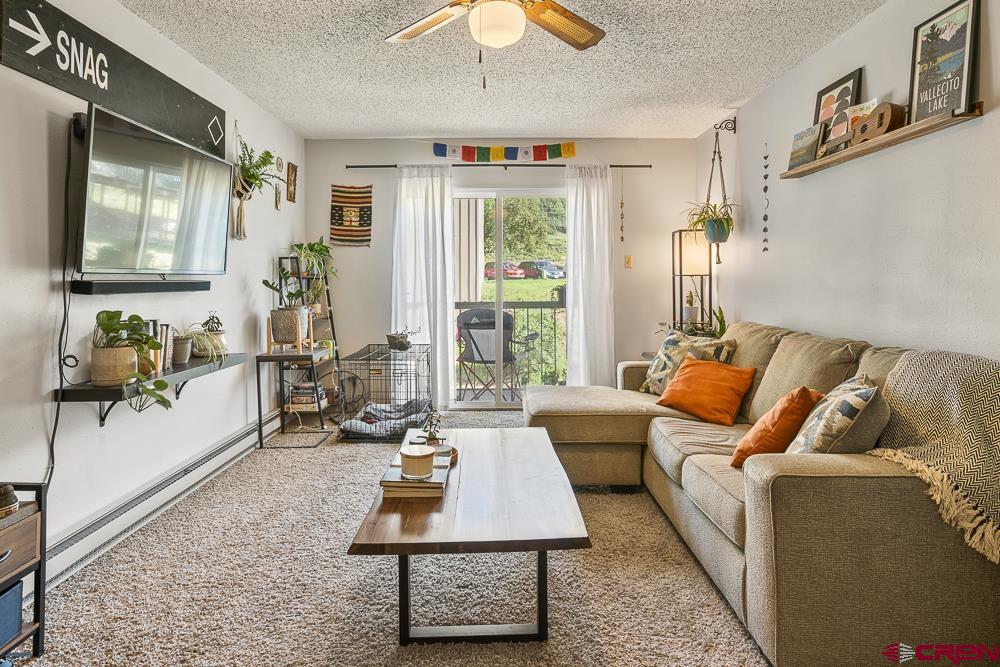 34237 Highway 550, Unit 18 Durango, CO 81301 - Photo 6 of 21 a living room with furniture rug and window