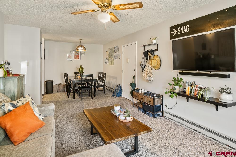 34237 Highway 550, Unit 18 Durango, CO 81301 - Photo 9 of 21 a living room with furniture and a flat screen tv