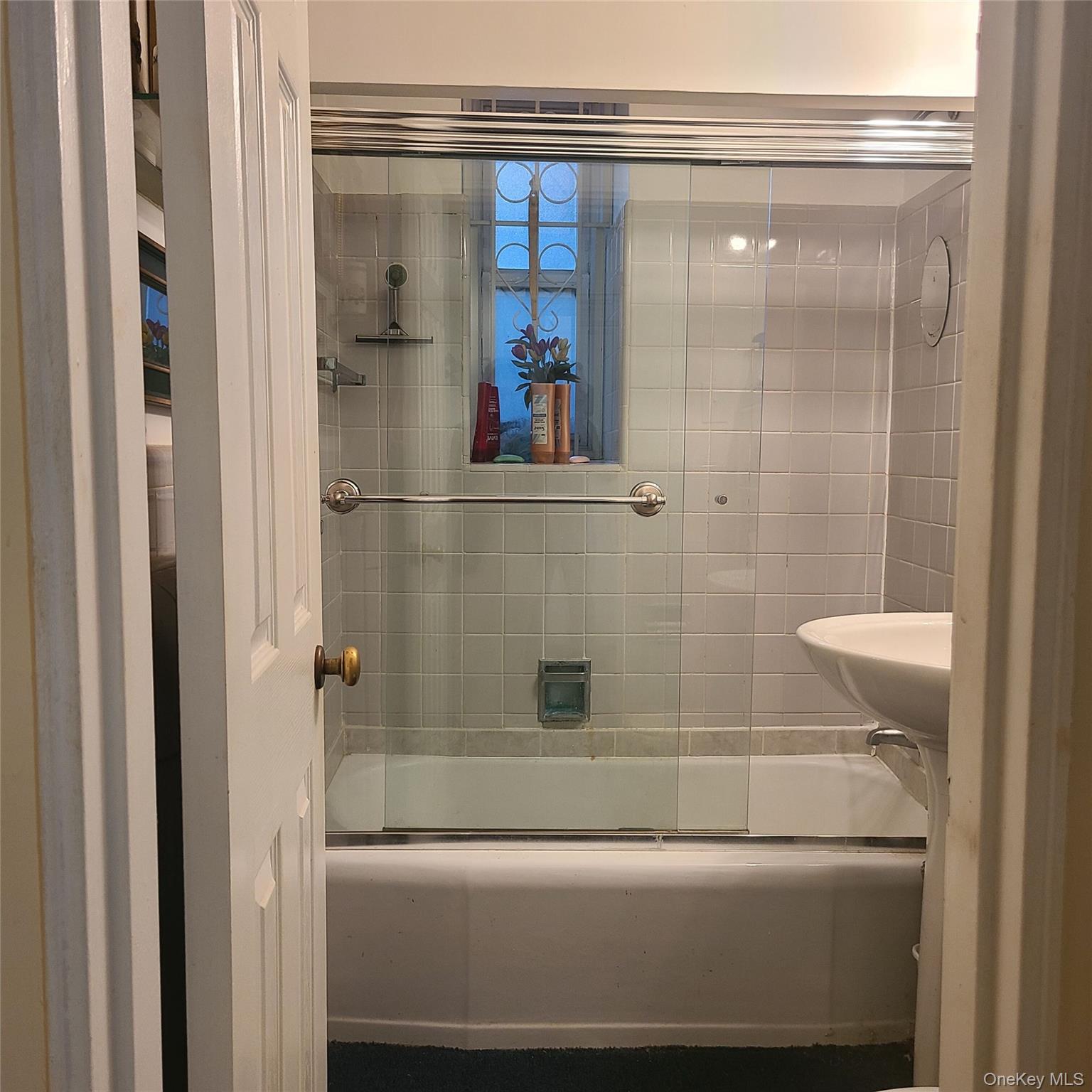 83-25 98th Street, Unit 2T Queens, NY 11421 - Photo 6 of 6 a bathroom with a shower