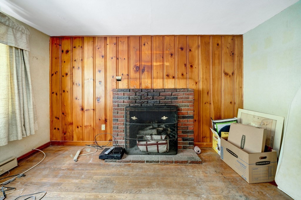 11 Flavell Road Groton, MA 01450 - Photo 26 of 26 a living room with furniture and a fireplace