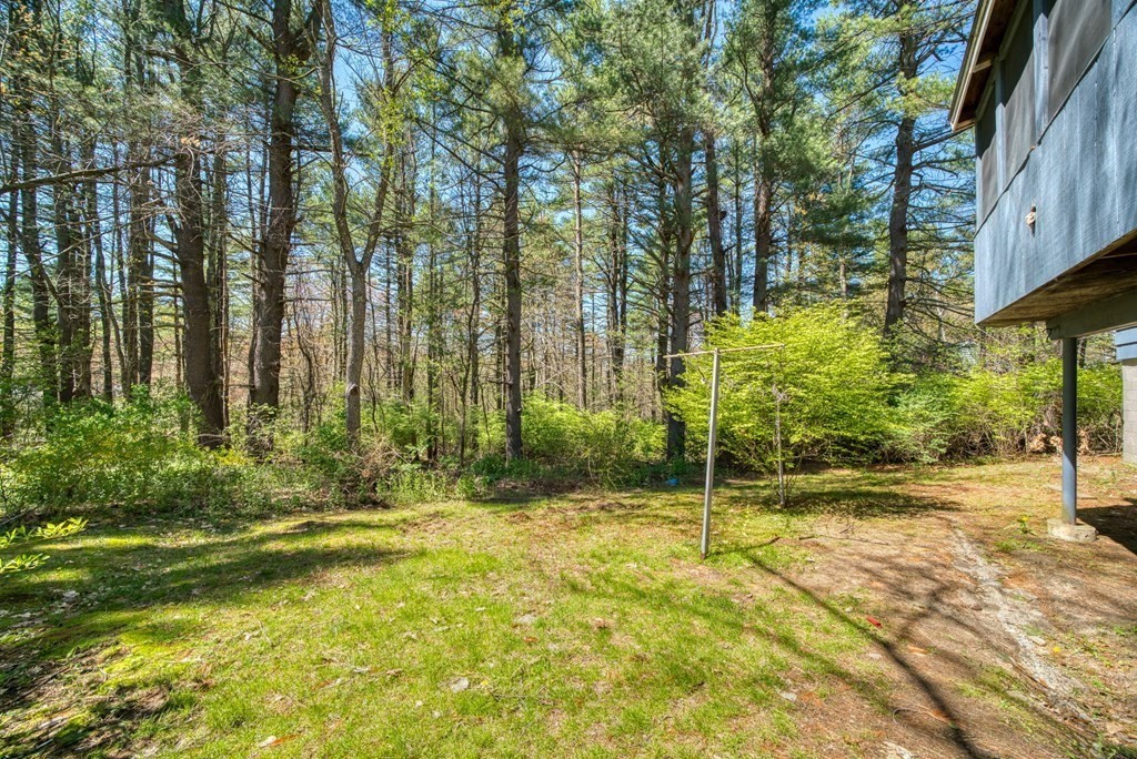 11 Flavell Road Groton, MA 01450 - Photo 3 of 26 a view of yellow house with large trees