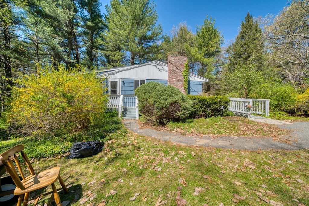 11 Flavell Road Groton, MA 01450 - Photo 4 of 26 a front view of a house with a yard and tree