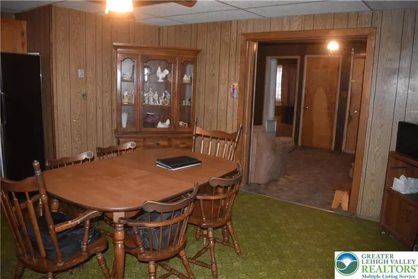a dining room with table and chairs