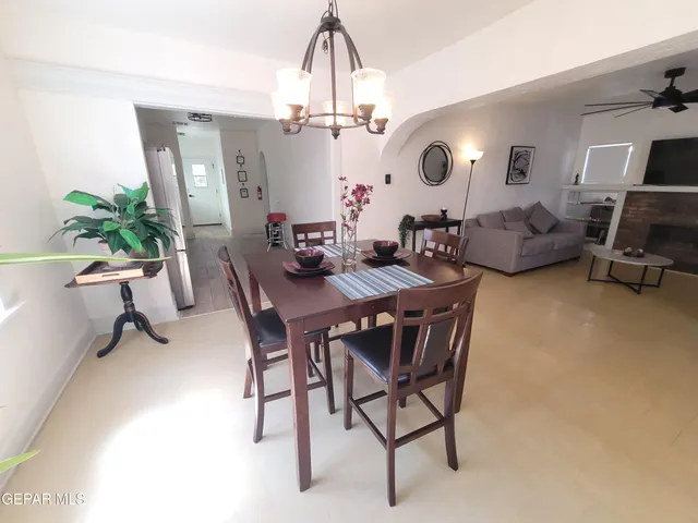 a kitchen with stainless steel appliances a sink a stove a refrigerator and cabinets