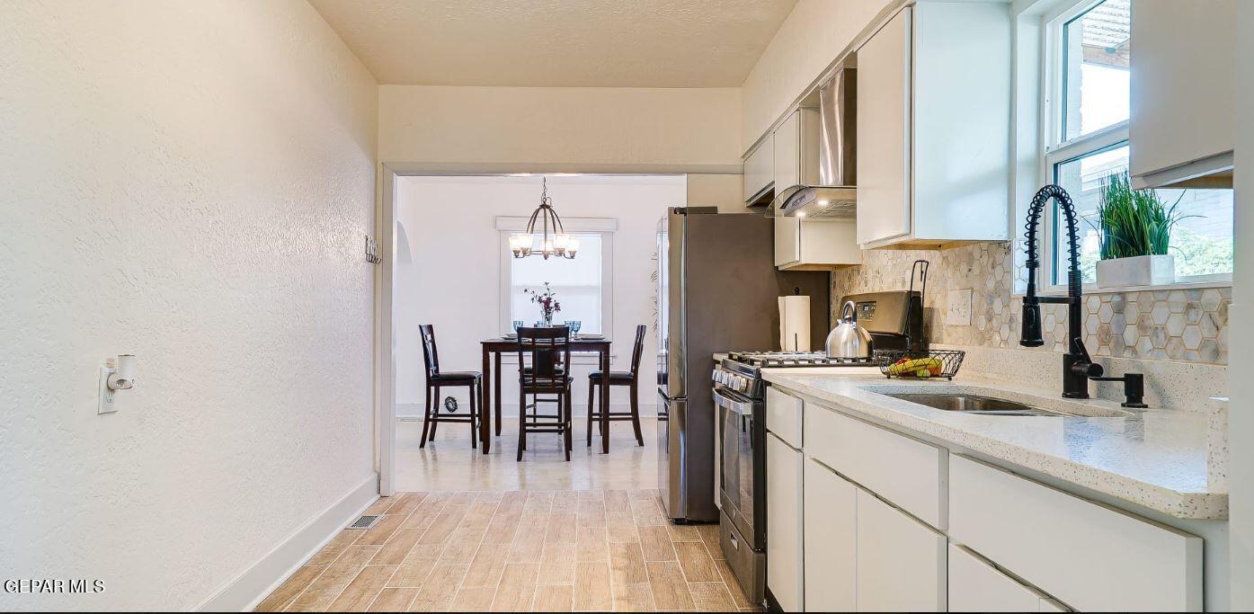 4012 Trowbridge Drive, Unit A FURNISHED El Paso, TX 79903 - Photo 15 of 53 a kitchen with refrigerator and cabinets