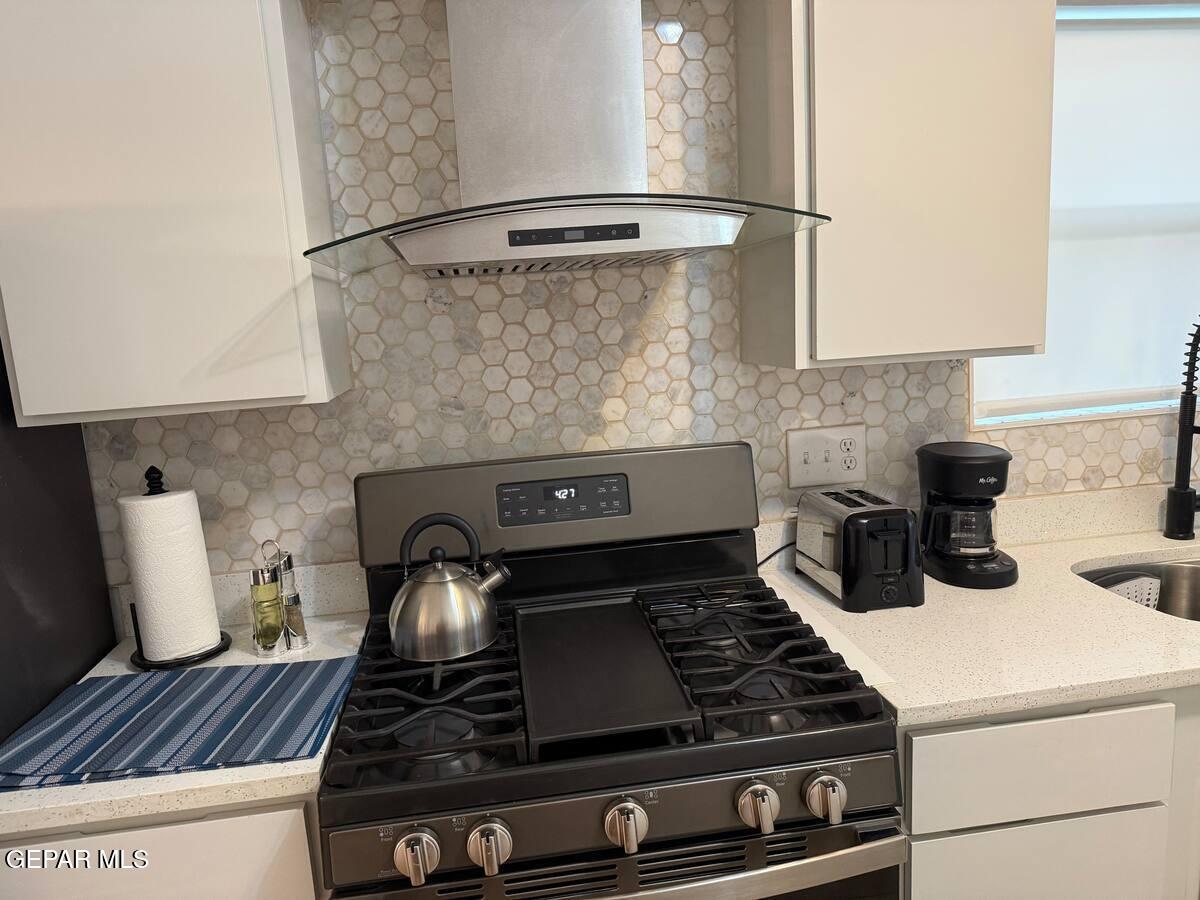 4012 Trowbridge Drive, Unit A FURNISHED El Paso, TX 79903 - Photo 19 of 53 a stove top oven sitting inside of a kitchen
