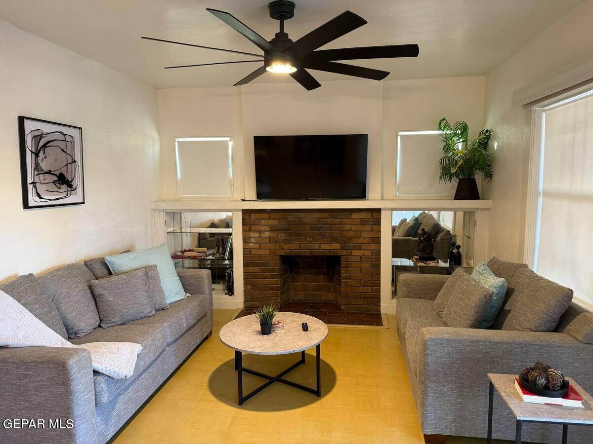 4012 Trowbridge Drive, Unit A FURNISHED El Paso, TX 79903 - Photo 2 of 53 a living room with furniture and a fireplace