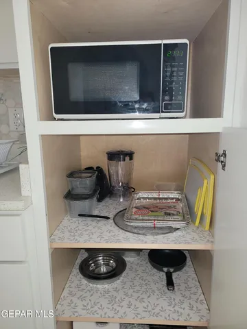 a bathroom with a shower and a sink