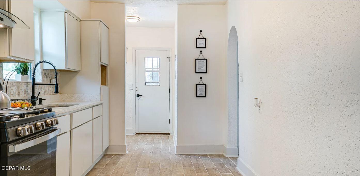 4012 Trowbridge Drive, Unit A FURNISHED El Paso, TX 79903 - Photo 29 of 53 a view of a kitchen with fridge and wooden floor