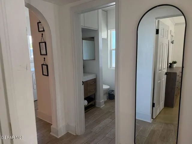 a bathroom with a sink a mirror and a shower