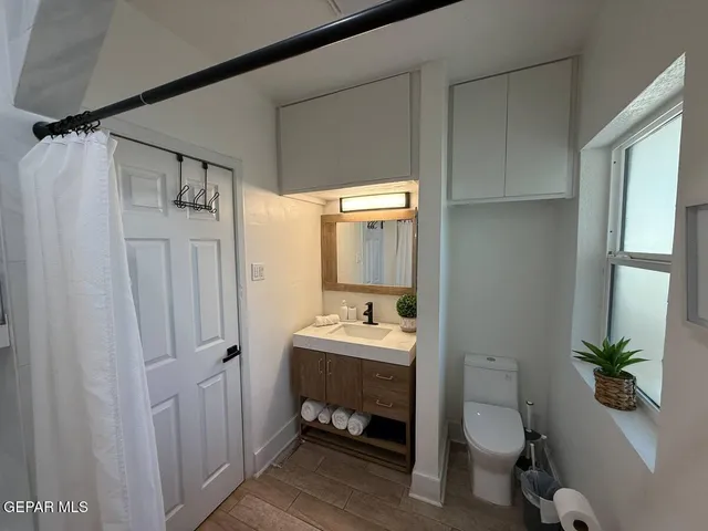 a bedroom with a bed and night stand