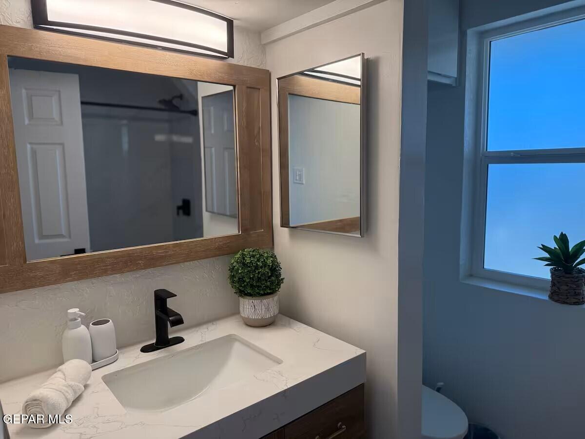 4012 Trowbridge Drive, Unit A FURNISHED El Paso, TX 79903 - Photo 33 of 53 a bathroom with a sink vanity and toilet