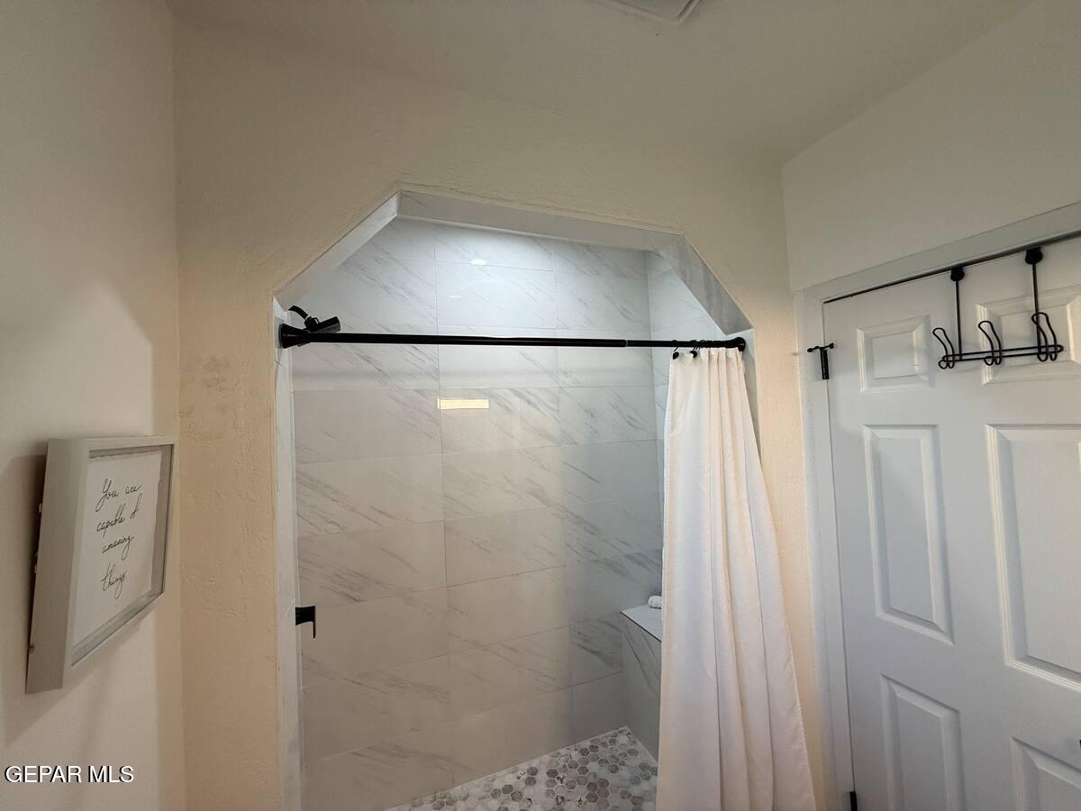 4012 Trowbridge Drive, Unit A FURNISHED El Paso, TX 79903 - Photo 34 of 53 a bathroom with a shower and a sink