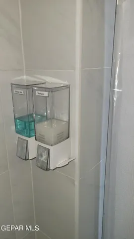 a view of a workspace room with furniture and wooden floor