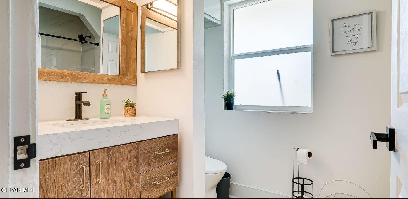 4012 Trowbridge Drive, Unit A FURNISHED El Paso, TX 79903 - Photo 38 of 53 a bathroom with a sink a mirror and a shower