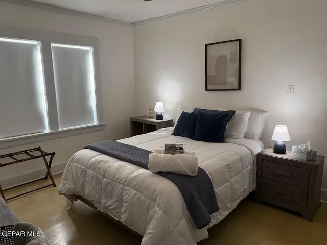 a view of a dining room with furniture and a window