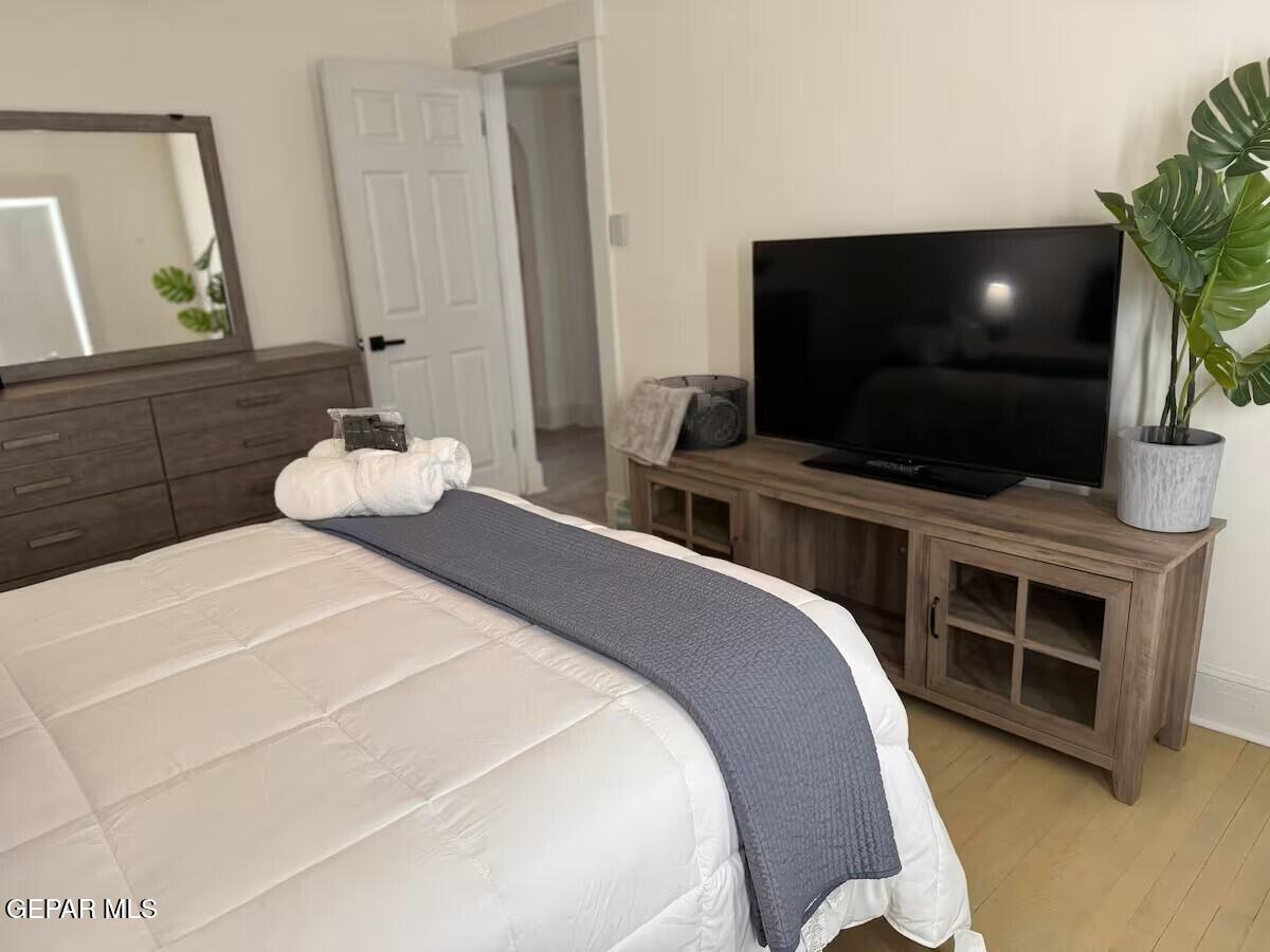 4012 Trowbridge Drive, Unit A FURNISHED El Paso, TX 79903 - Photo 42 of 53 a bedroom with a bed and a flat screen tv