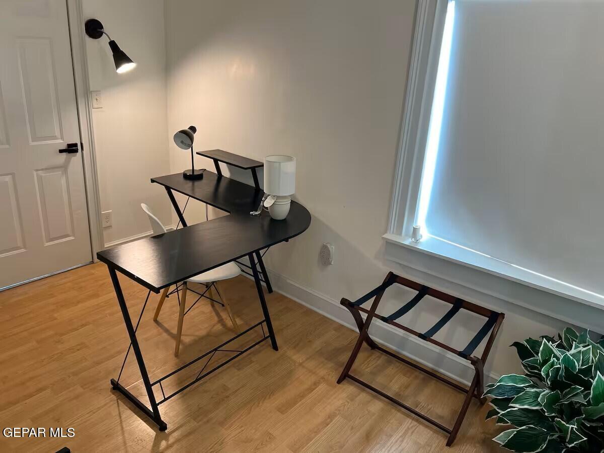 4012 Trowbridge Drive, Unit A FURNISHED El Paso, TX 79903 - Photo 46 of 53 a view of a workspace room with furniture and wooden floor