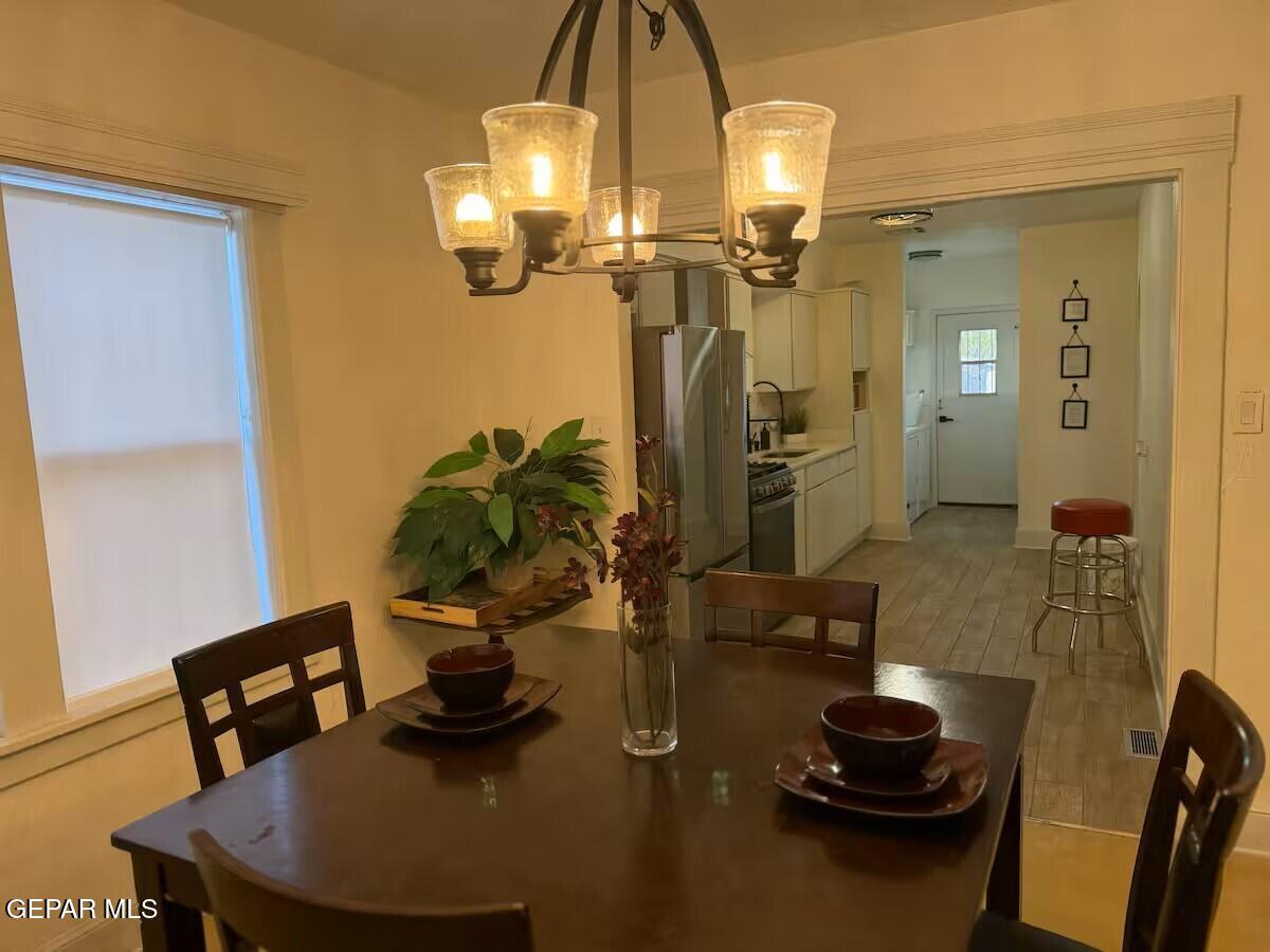 4012 Trowbridge Drive, Unit A FURNISHED El Paso, TX 79903 - Photo 6 of 53 a dining room with furniture and wooden floor