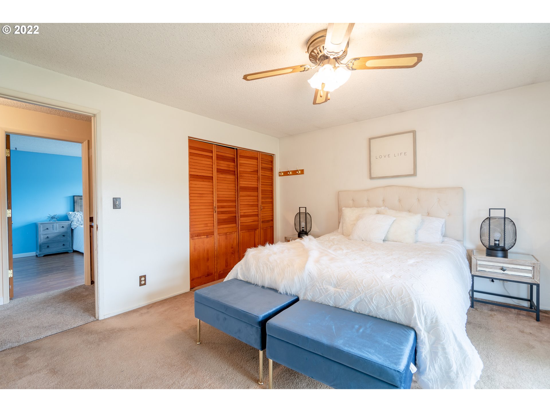 931 South 38th Street Springfield, OR 97478 - Photo 11 of 32 a bedroom with a bed and a chandelier