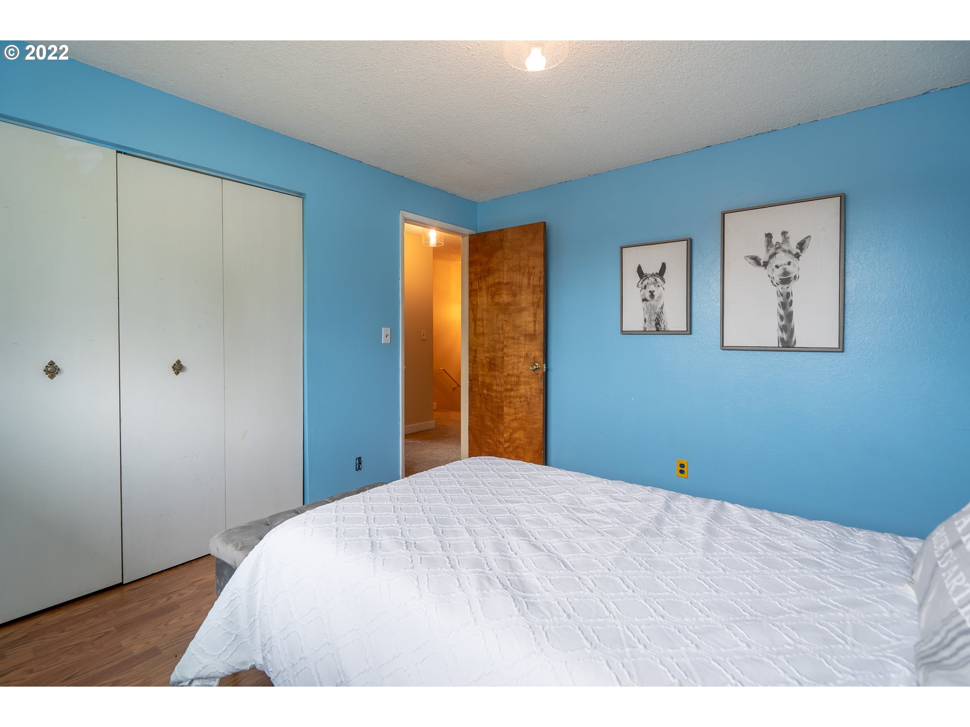 931 South 38th Street Springfield, OR 97478 - Photo 13 of 32 a bedroom with a bed and painting on the wall