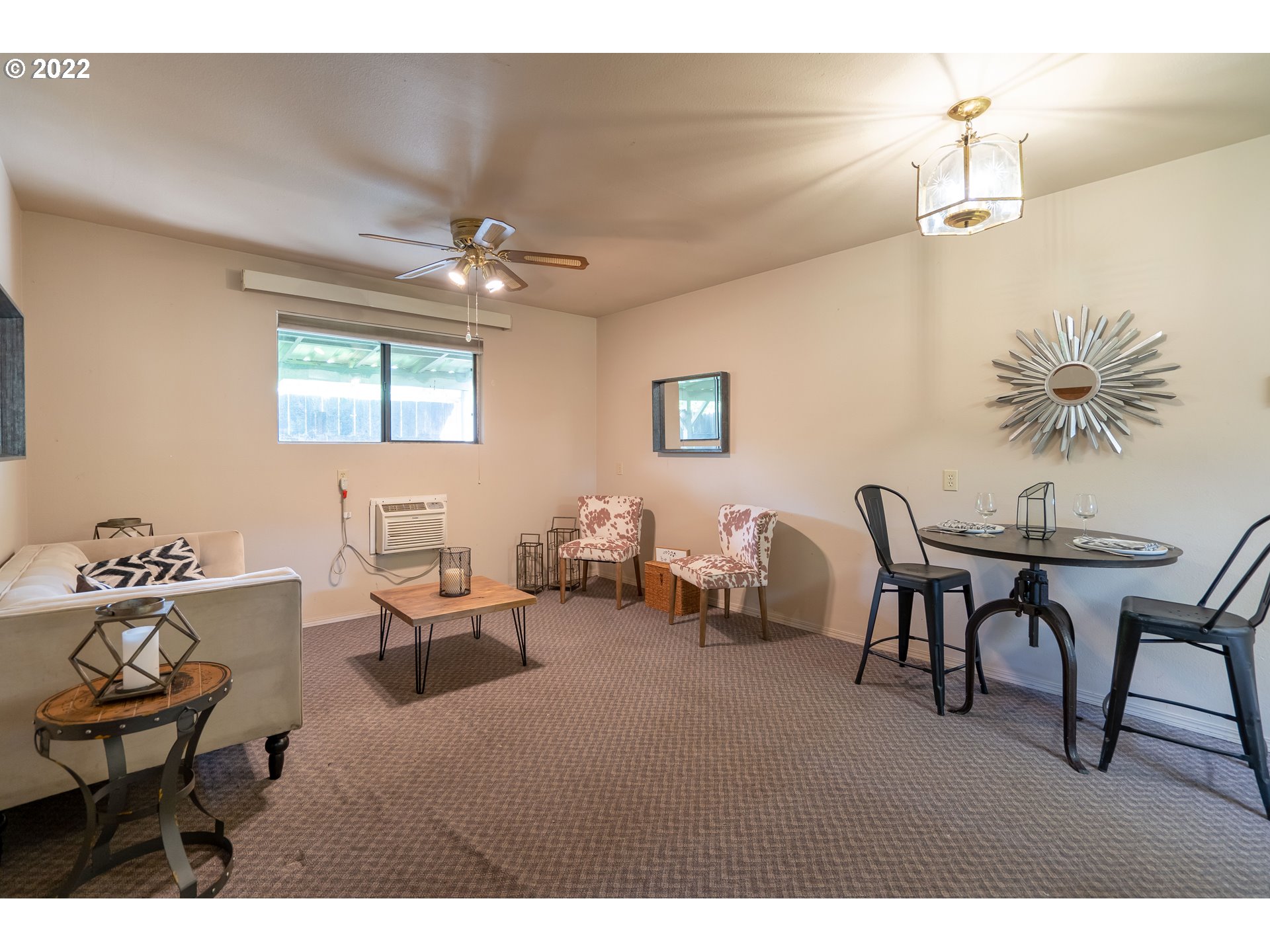 931 South 38th Street Springfield, OR 97478 - Photo 25 of 32 a living room with furniture a chandelier and a window