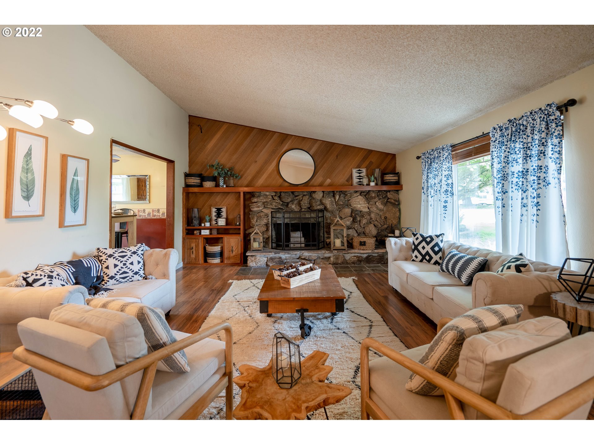 931 South 38th Street Springfield, OR 97478 - Photo 4 of 32 a living room with furniture a fireplace and a large window