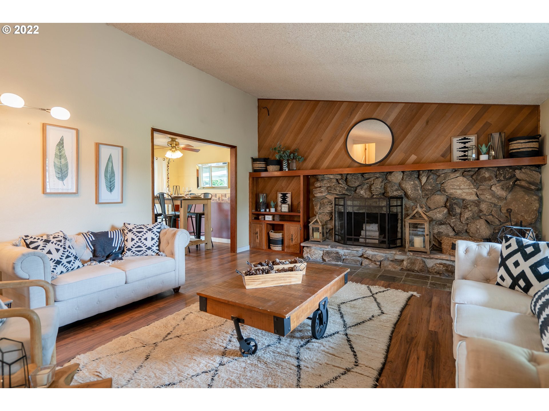 931 South 38th Street Springfield, OR 97478 - Photo 5 of 32 a living room with furniture a fireplace and a flat screen tv