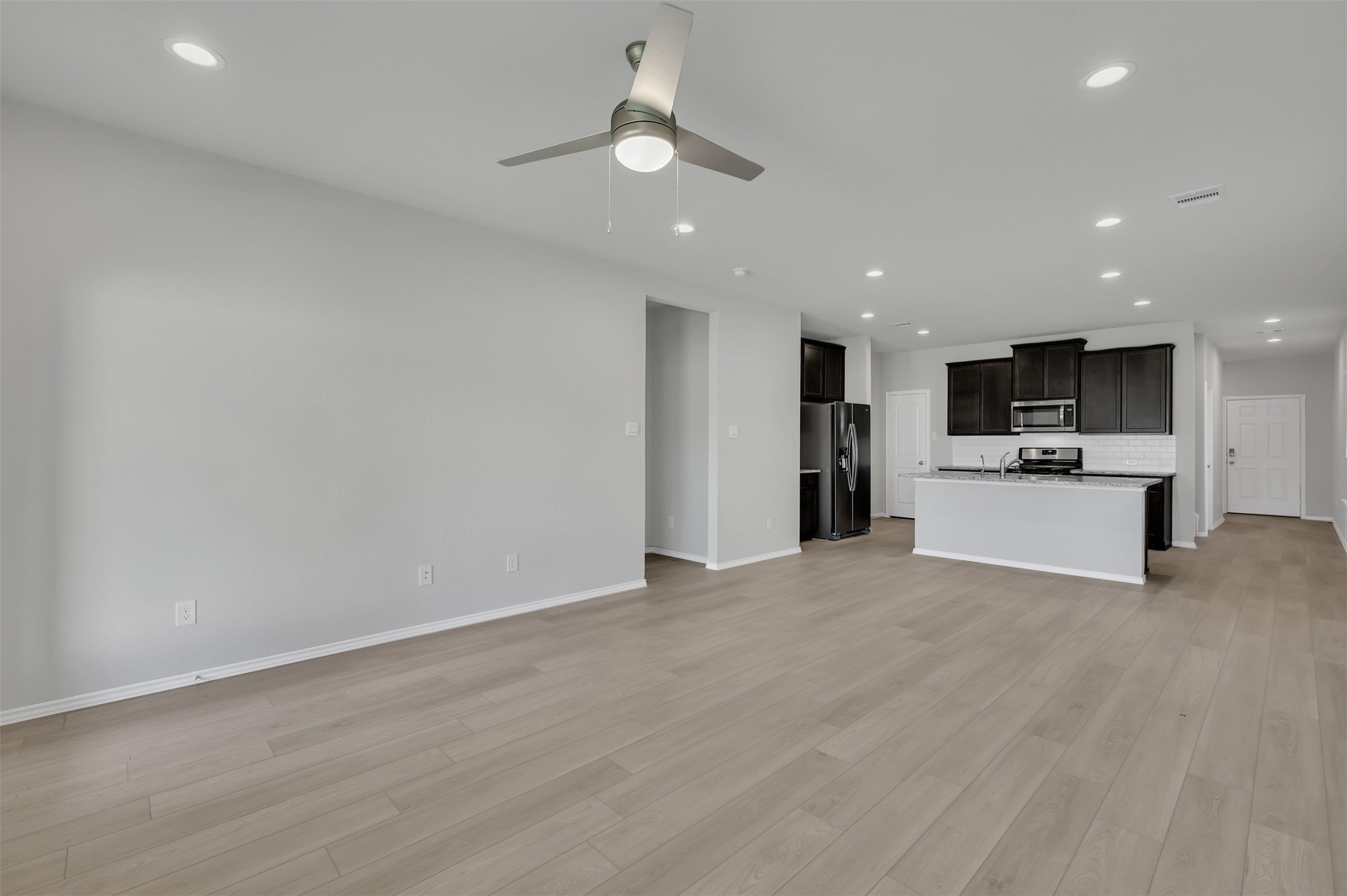17105 Upland Bent Court Conroe, TX 77385 - Photo 15 of 40 a view of kitchen and refrigerator